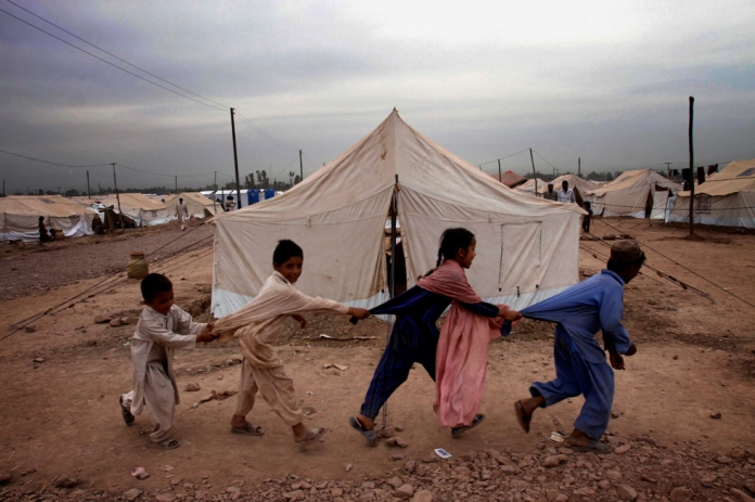 Refugee children from Pakistan's troubled Swat Valley who fled fighting, play in Jalozai camp, Monday, May 18, 2009 in Peshawar, Pakistan. The Pakistani Taliban have vowed to resist until the "last breath" as security forces entered two militant-held towns and fought on the outskirts of a third in what could turn into bloody urban battles near the Afghan border. (AP Photo/ Mohammad Sajjad)
